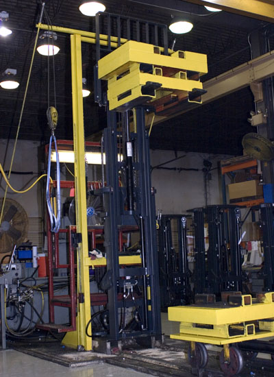 Lift Technologies, Inc. Inspection stand at end of production area for new masts